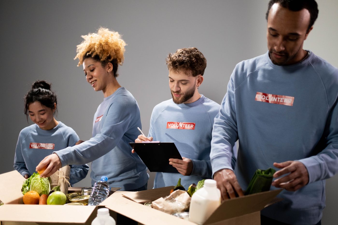 A volunteer team working together to prepare community donations