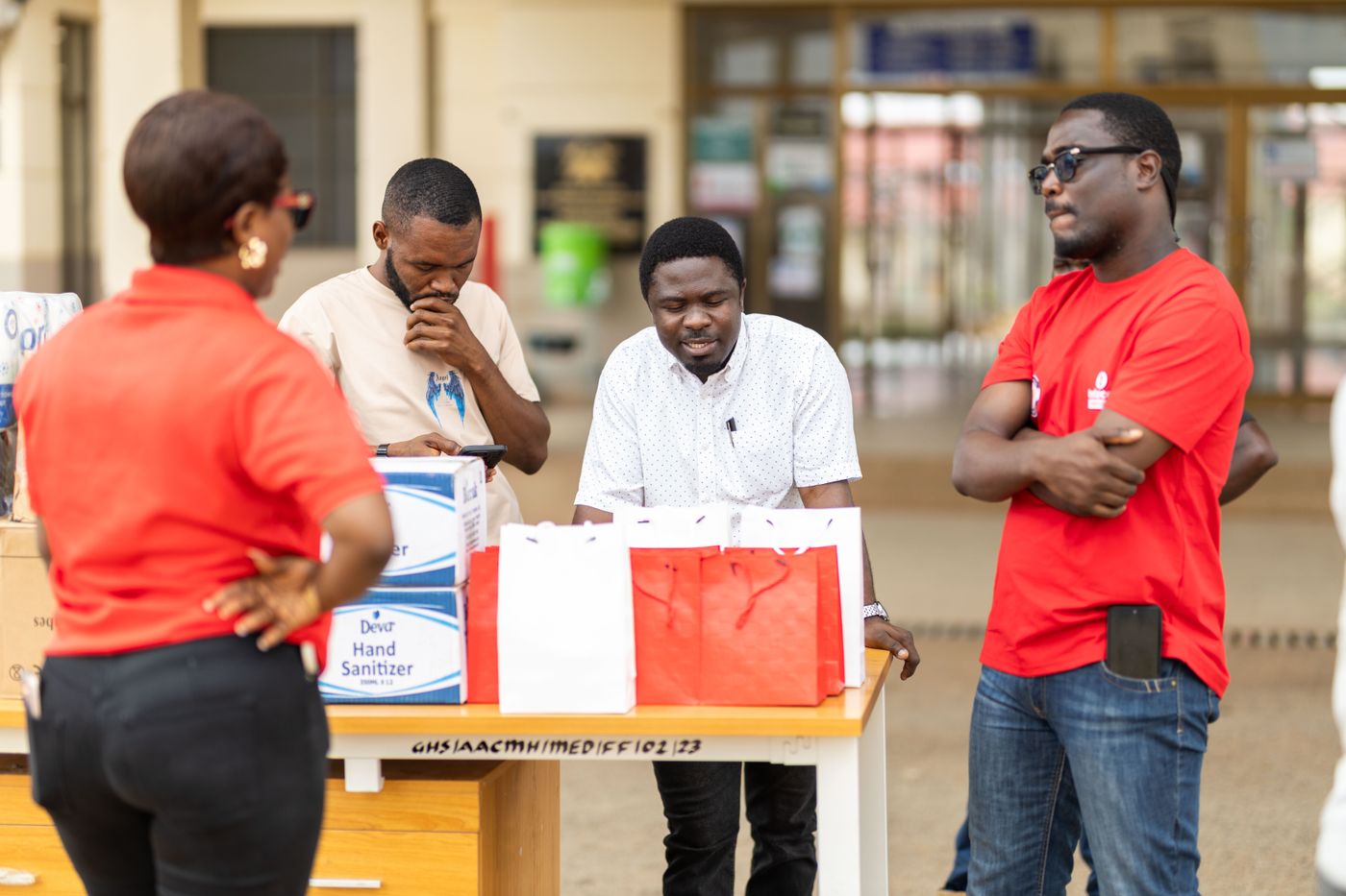 Community health volunteers organizing supplies during an outreach initiative