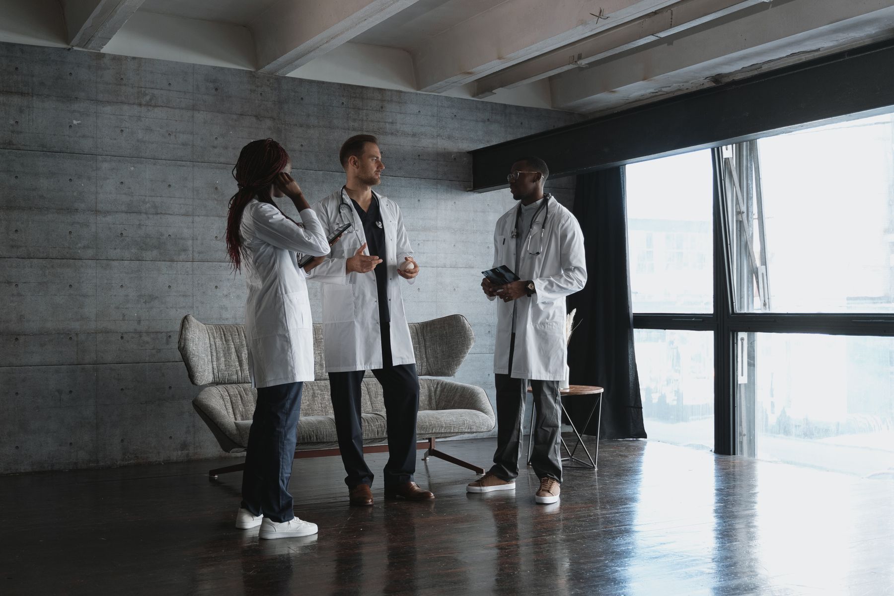 Healthcare professionals collaborating in a bright clinical workspace